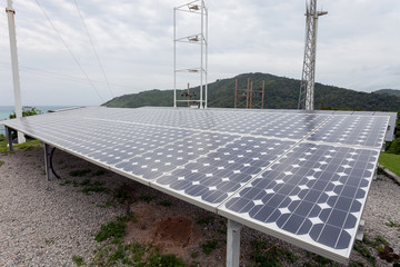 Solar panels,wind turbines on sky background,natural Energy.