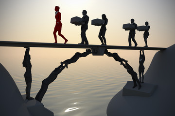 Team bridge made of people near the sea.
A bridge next to the sea made of people, where a leader and the rest of the team executives carry items from one side to the other.