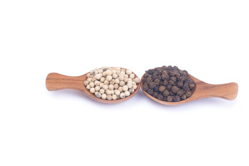 Close up white and peppercorns in wooden spoon isolated on white background