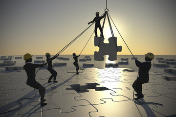 Jigsaw puzzle being built by teamwork at dusk.
A great jigsaw puzzle is being built by a team at dusk.