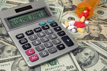 Medicare Part D text on calculator with prescription pills in bottle on American money - obrazy, fototapety, plakaty