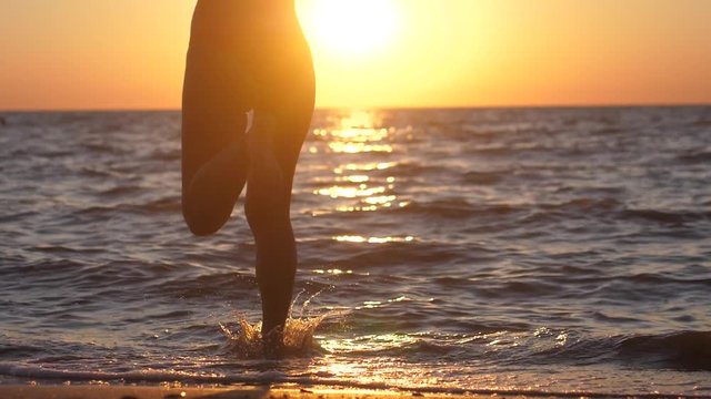 Young woman running into the sea. Summer woman beach freedom happy concept. Free during holidays vacation travel. slow motion. 1920x1080
