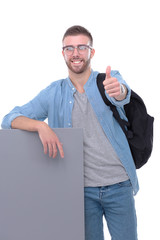 Portrait of a smiling male student holding blank board. Education opportunities. College student.