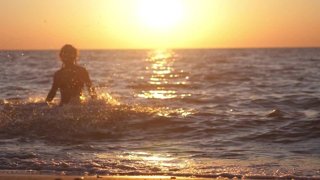 Summer woman beach freedom happy concept. Young woman is running out of the sea free during holidays vacation travel. slow motion. 1920x1080