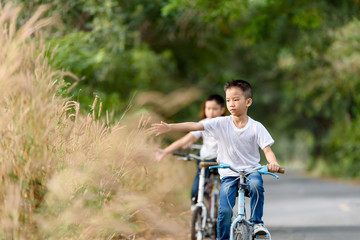 Naklejka premium Boy ride bicycle
