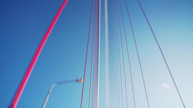 View Russian bridge (connects the mainland part of Vladivostok with Russian Island) road from luxurious yellow cabriolet driving along it. Sunny day