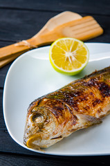Fried fish served on the plate