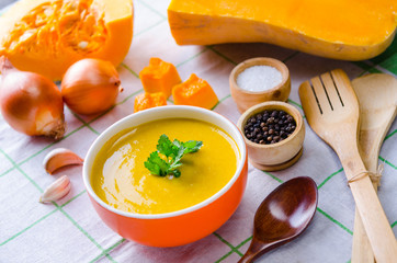 Pumpkin soup served on the table in bowl