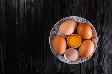 plate with chicken egg on black boards
