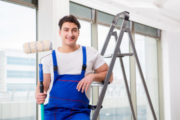 Painter repairman working at construction site