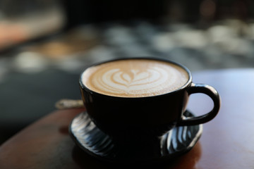 Cappuccino coffee break on wood background