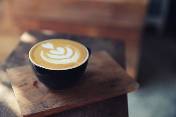 Cappuccino coffee break on wood background