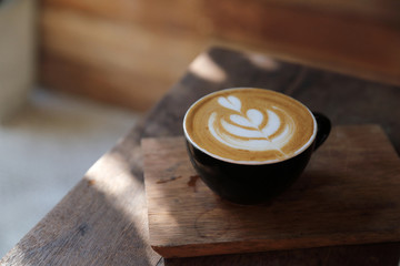 Cappuccino coffee break on wood background