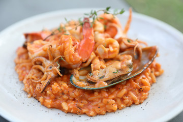 seafood risotto with mussel shrimp and squid , italian food