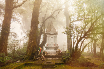 A white pagoda shrine of guardian god in the middle of the jungle.Thailand.
