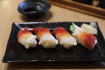 Surf clam nigiri sushi - japanese food style on wood background
