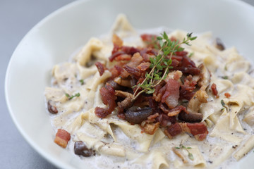 pasta fettuccine alfredo white sauce with ham bacon and mushroom