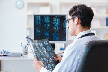 Doctor radiologist looking at x-ray images