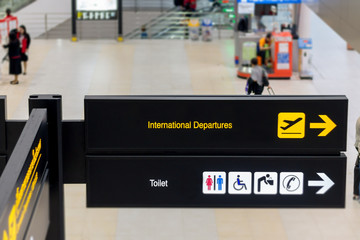 International departures and toilet sign in the airport