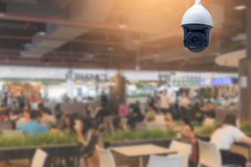 Modern CCTV security camera in the food court