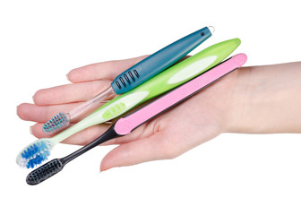 Toothbrushes in hand