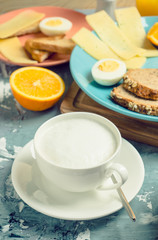 Obraz na płótnie Canvas Breakfast table with various food. Selective focus.