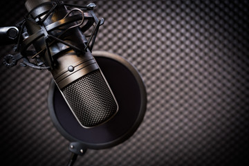 condenser microphone in recording studio, music background