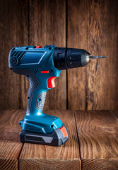 electric screwdriver on a wooden background