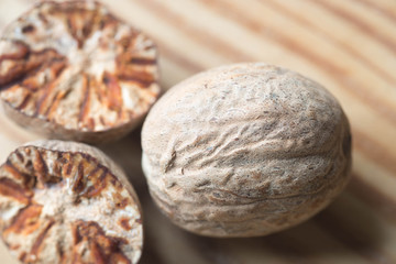 nutmeg on wooden table macro