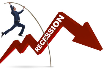 Businessman pole vaulting over crisis in business concept