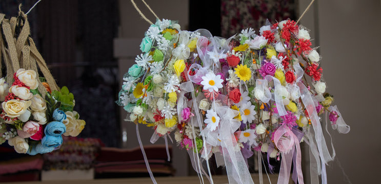 colorful crowns made of fake flowers