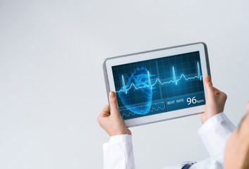 Close of female doctor hands working with tablet pc computer
