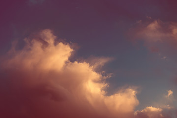 Beautiful colorful sky with clouds and sunlight. Color toned.