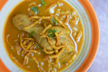 Kao Soi Kai or Thai Northern Style Egg Noodle in Curry Soup with Chicken