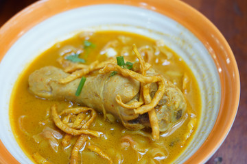 Kao Soi Kai or Thai Northern Style Egg Noodle in Curry Soup with Chicken