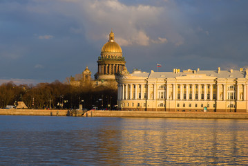 Saint Isaacs Cathedral and the Constitutional Court building on a sunny April evening. Saint-Petersburg, Russia