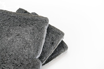 loaf slide of charcoal bread black bread isolated on white