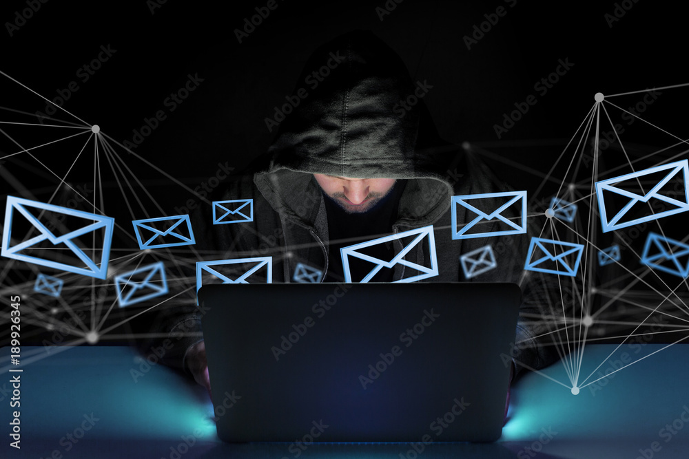 Poster hacker man in the dark using computer to hack data and information system