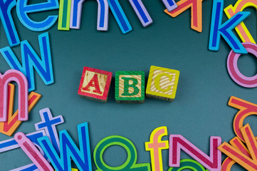 Close up arrangement of alphabet on green board. Preschool, education concept or other your content.