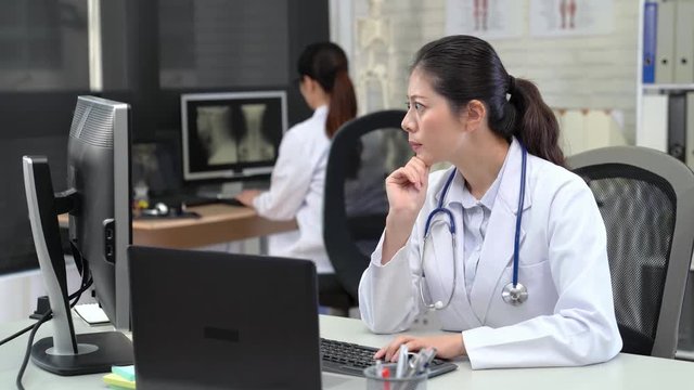 Asian female Doctor Working