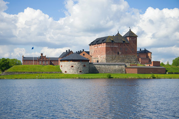 The Hameenlinna fortress on the shore of the lake on a sunny June day. Finland