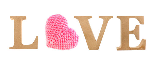 Love letter made from wood with pink heart knitting