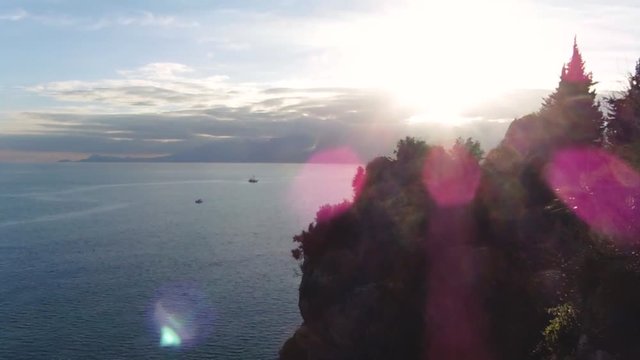 Timelapse. Sea view at sun rays on the mountains background. Beautiful seascape at sunset