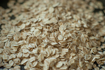Obraz premium healthy eating. raw oat flakes