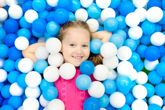 Kids Play In Ball Pit. Child Playing In Balls Pool