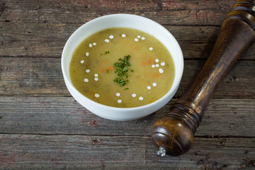 Veal soup with vegetables. On a wooden background. Top view. rustic food