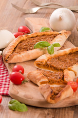 Turkish pide pizza with meat and onion. 