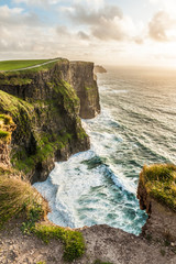 The Cliffs of Moher, Ireland Most Visited Natural Tourist Attraction, are sea cliffs located at the southwestern edge of the Burren region in County Clare, Ireland.