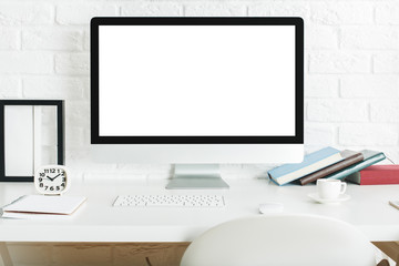 Designer desktop with blank white computer