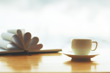 Coffee cup and book